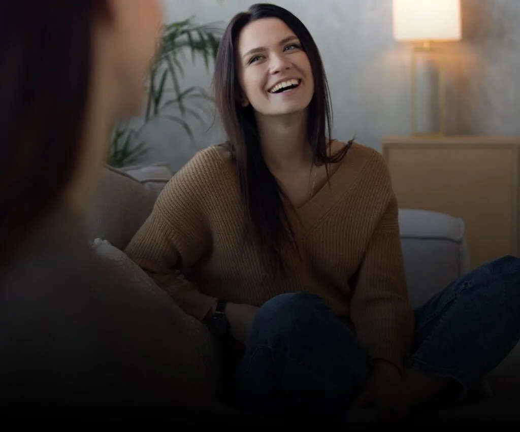 Smiling woman talking with her therapist