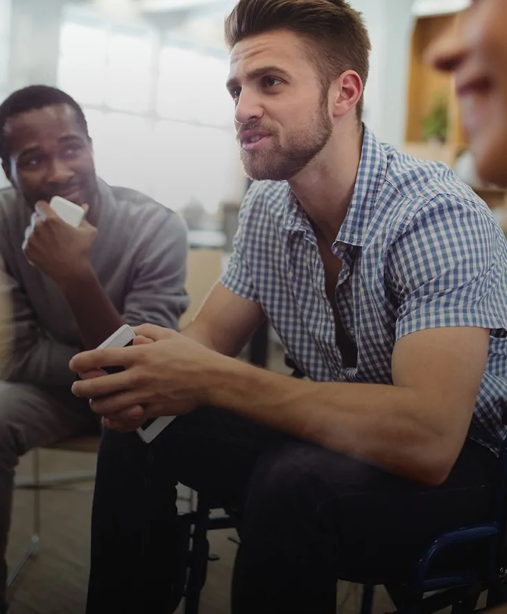 Men talking during a support group session