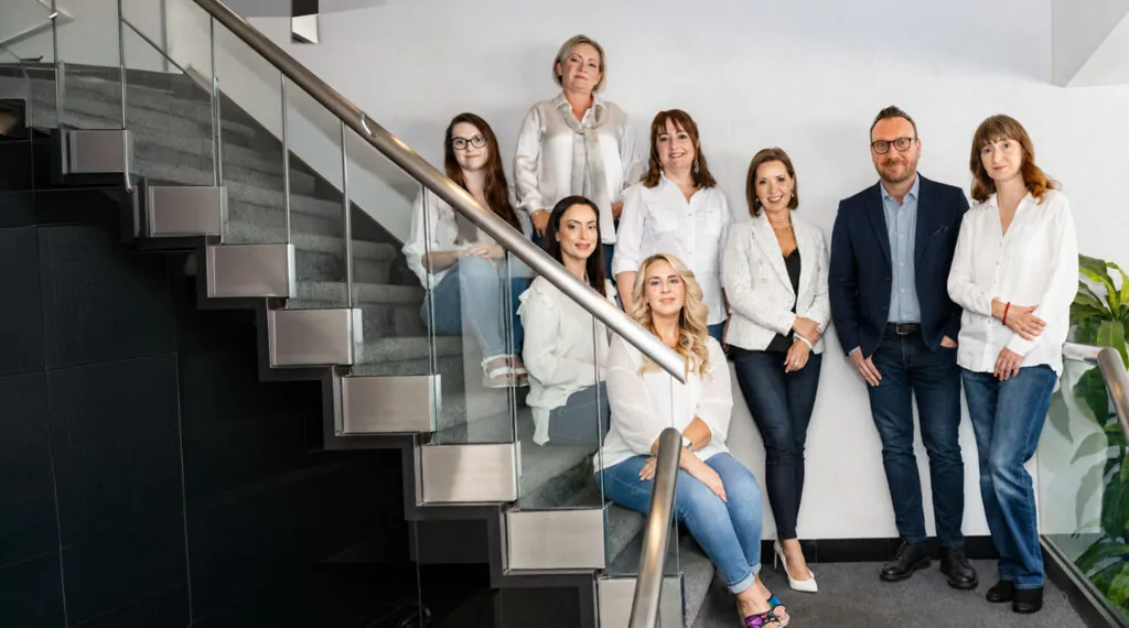 AMBH team on the office staircase in Chicago
